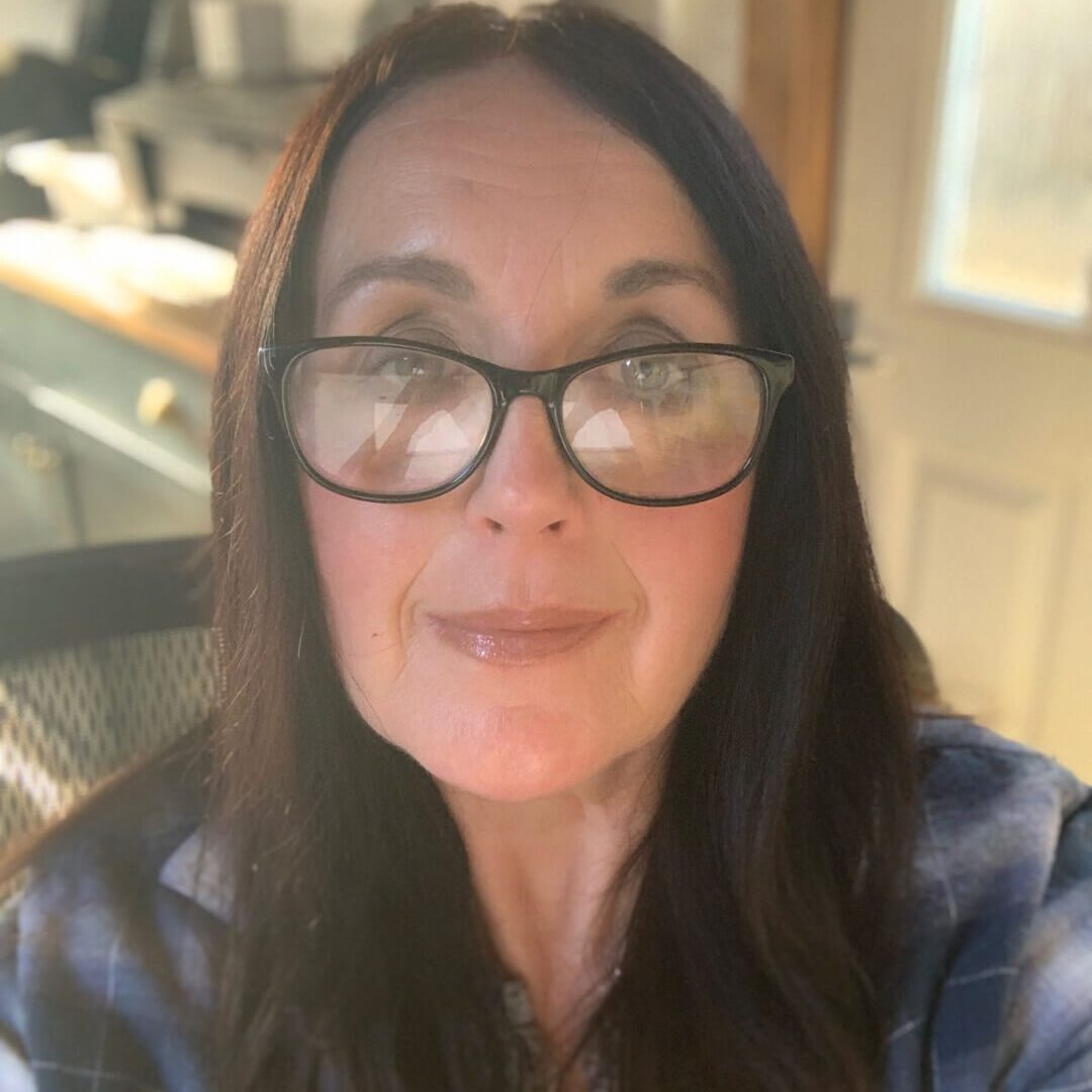 Woman in blue flannel shirt